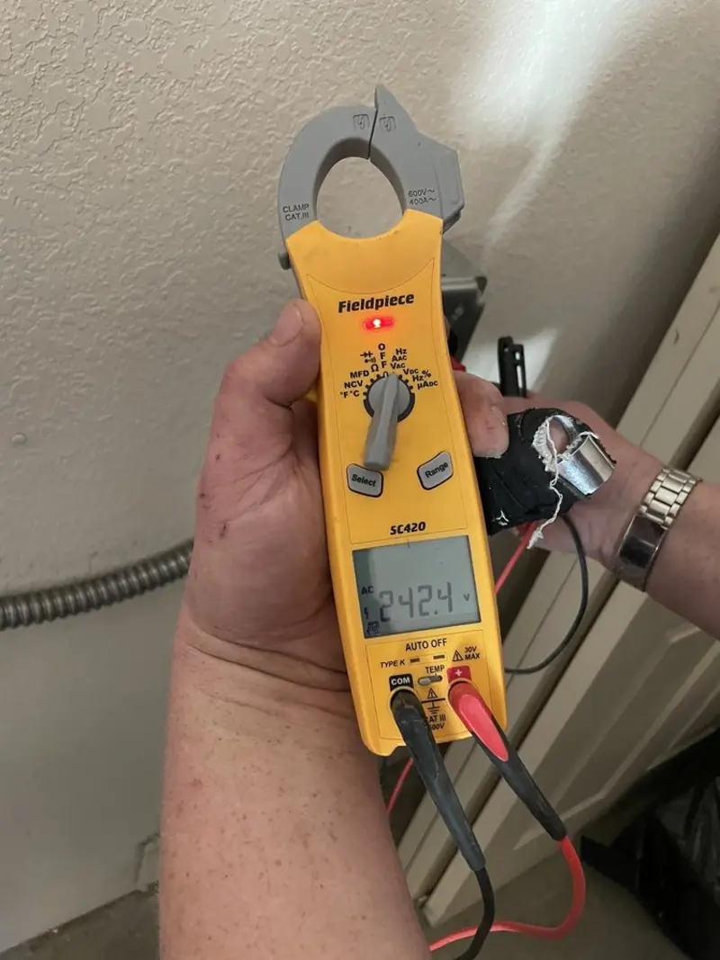 Voltage testing with clamp meter during Outlet Installation in Strawberry Plains